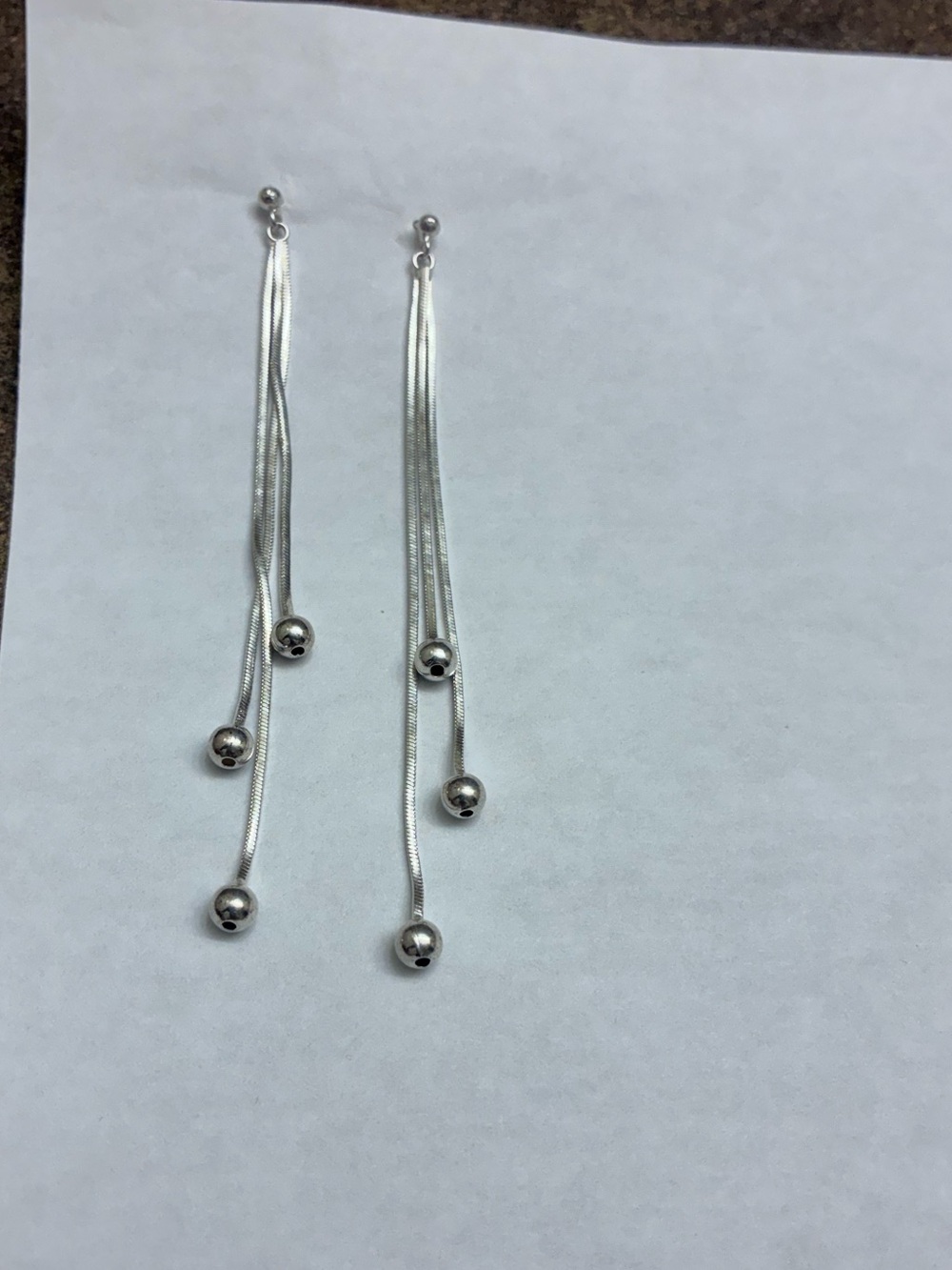 Four pairs silver pierced earrings